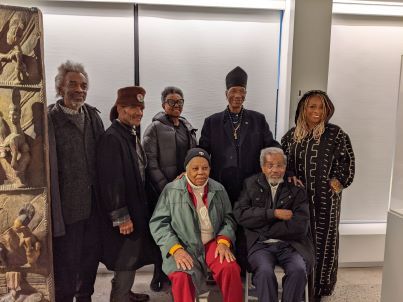 Eric and Edye Edwards (seated) amongst friends at the grand opening of the Cultural Museum of African Art, Inc for The Eric Edwards Collection.